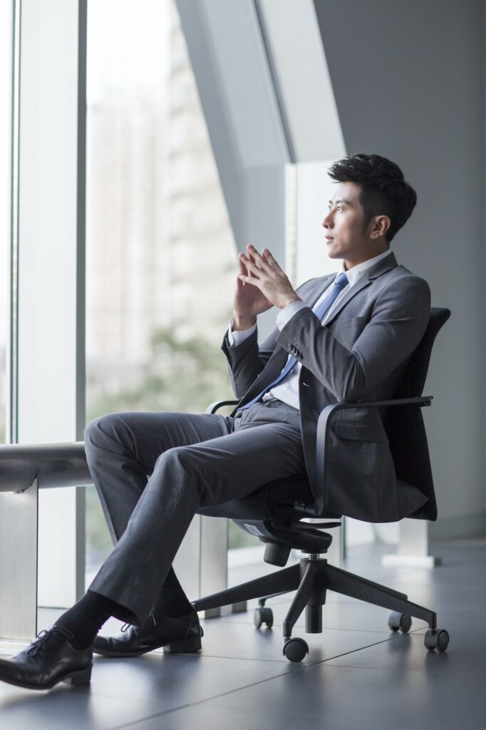 Young businessman looking at view